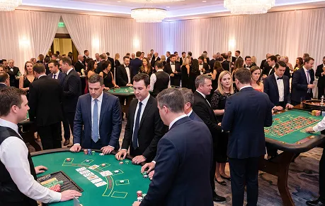 Corporate casino night with roulette and blackjack tables